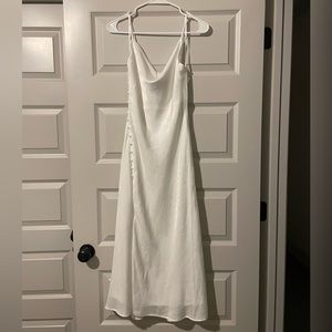 Lulu’s white satin dress. Buttons on left side along slit. Scoop neckline.